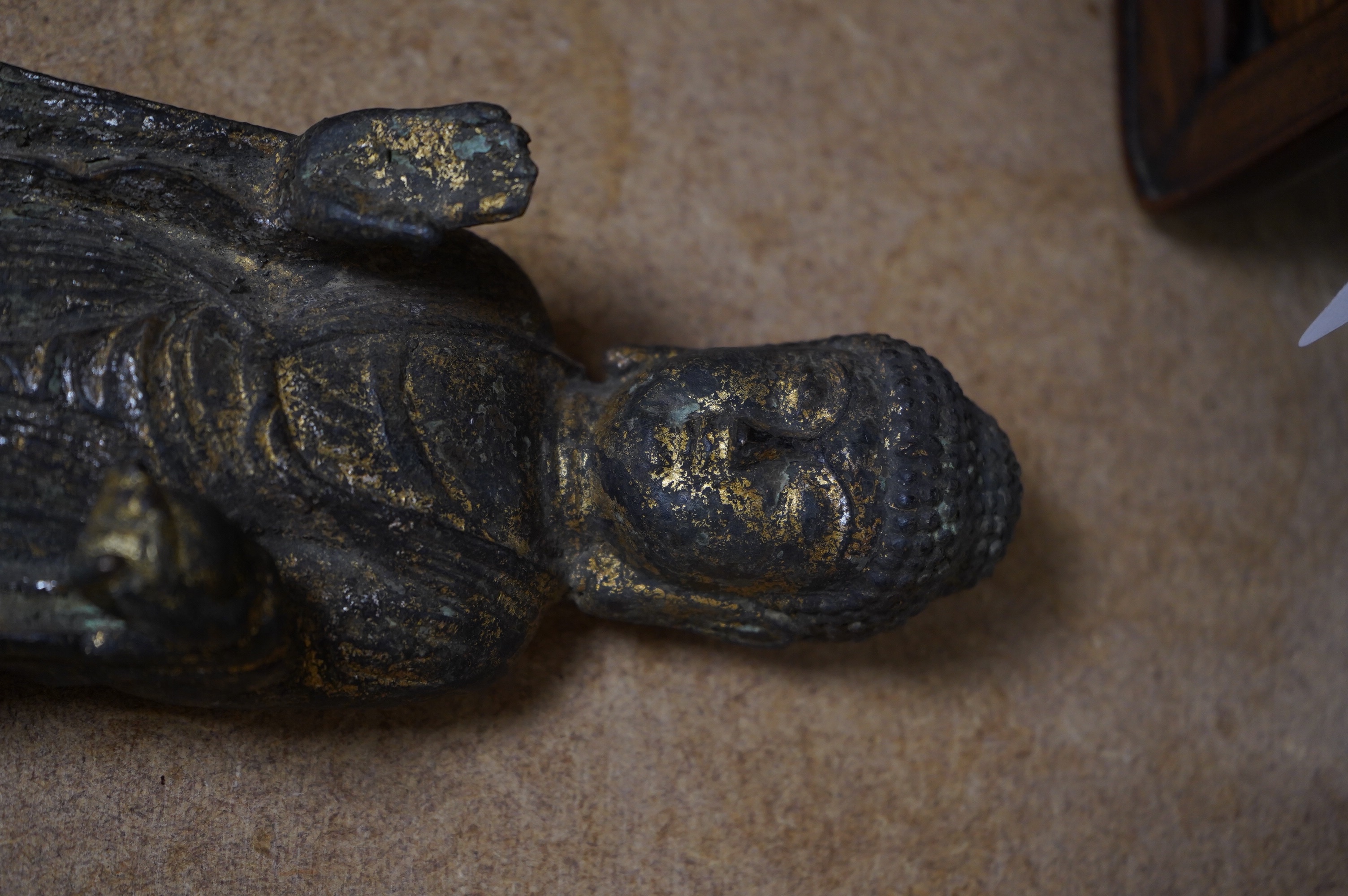 A Chinese gilt bronze model of a standing Buddha, 21.5cm. Condition - poor to fair